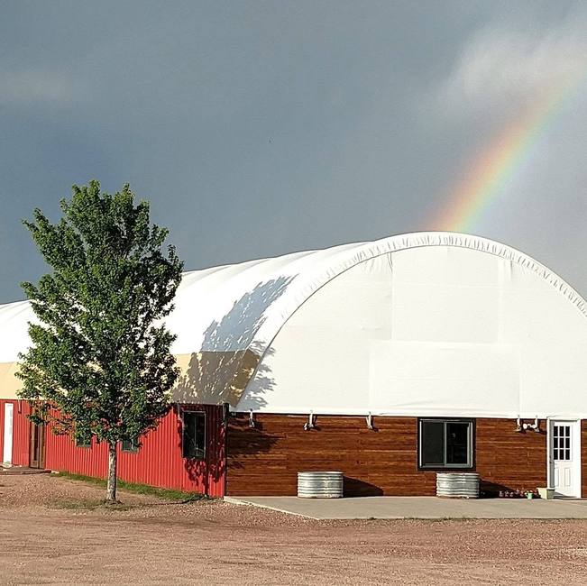 Castlewood Canyon Equine clinic exterior with rainbow